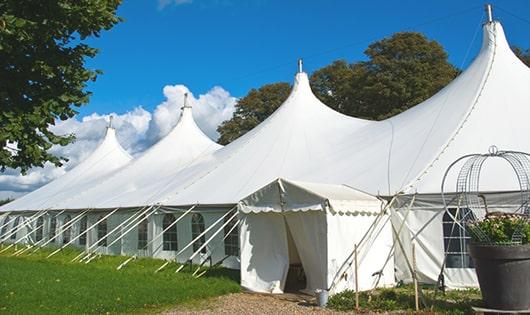 a group of luxury portable restrooms with individual stalls and running water in Laneville